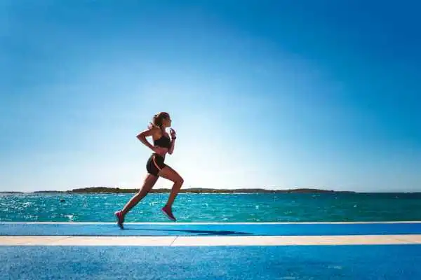 Woman running showing strong leg muscle South Side